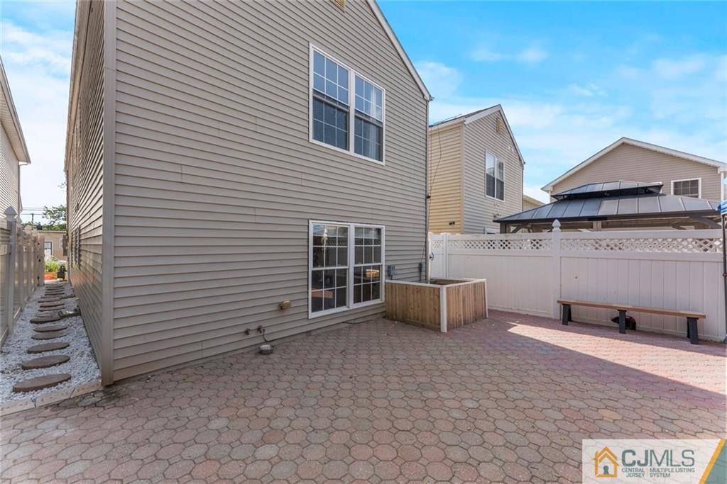 381 Prospect Street Perth Amboy, NJ 08861 - Photo 44 of 51 an outdoor view of a house with garage