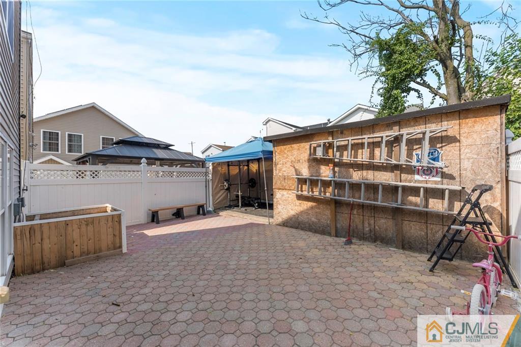 381 Prospect Street Perth Amboy, NJ 08861 - Photo 45 of 51 a front view of a house with balcony
