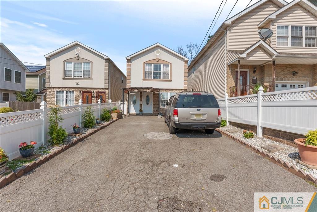 381 Prospect Street Perth Amboy, NJ 08861 - Photo 47 of 51 a car parked in front of a house