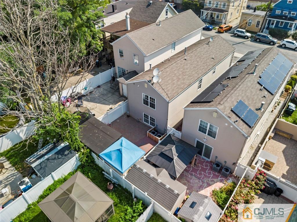 381 Prospect Street Perth Amboy, NJ 08861 - Photo 5 of 51 an aerial view of a house with a yard
