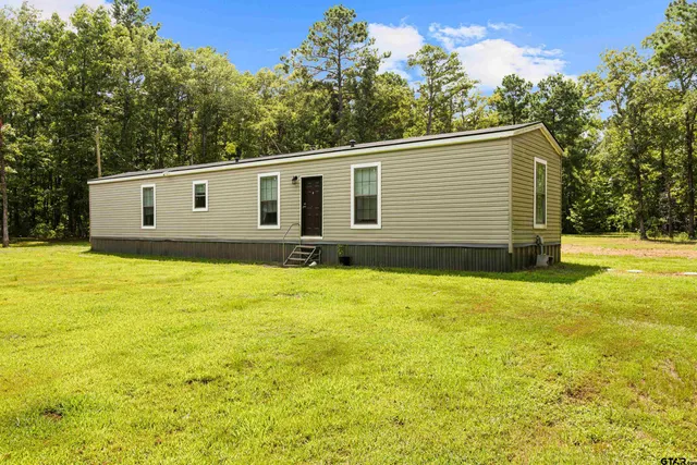 a house view with a garden space