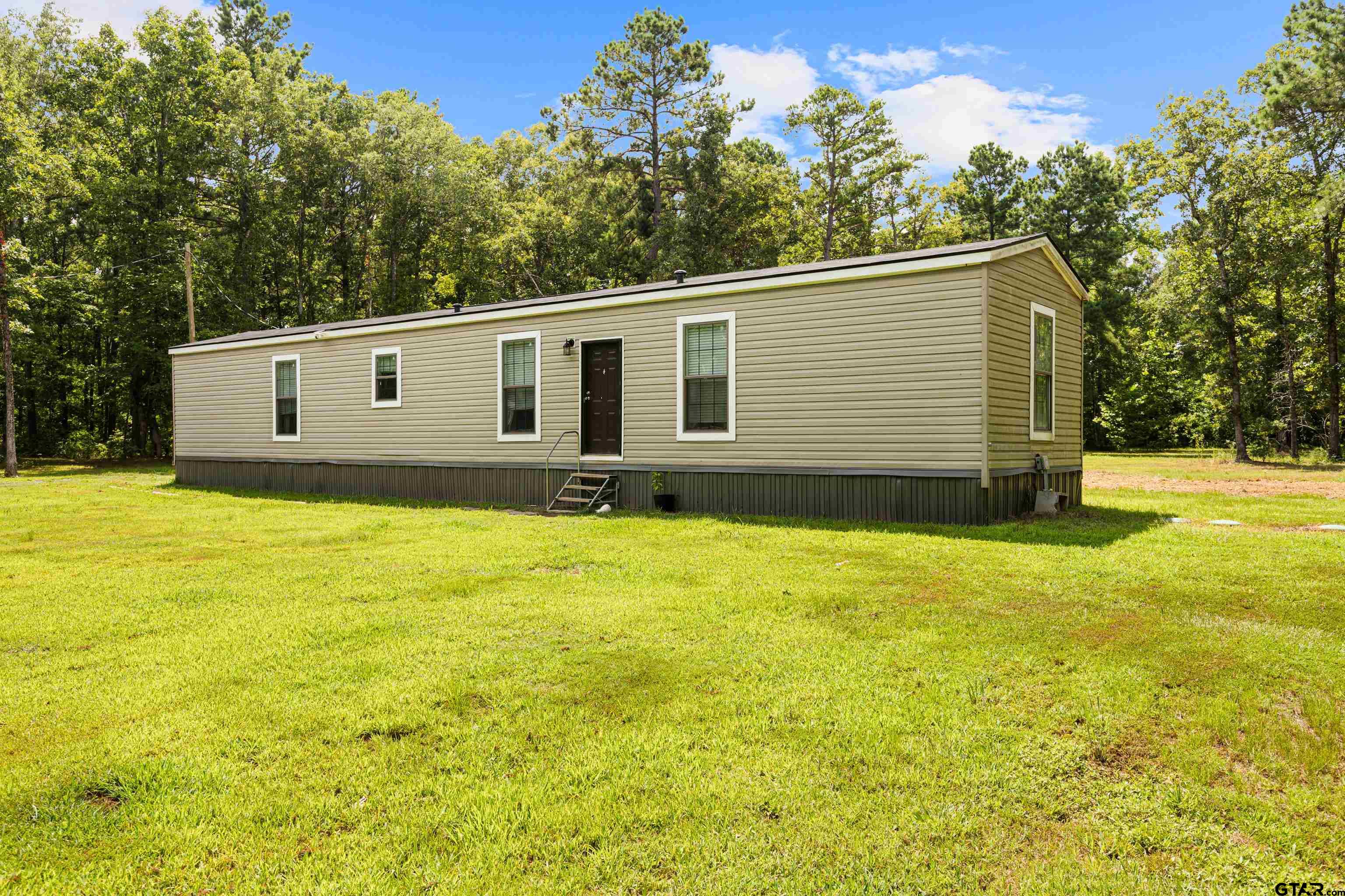 a house view with a garden space