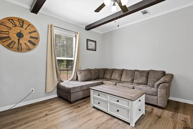 a living room with furniture and a window