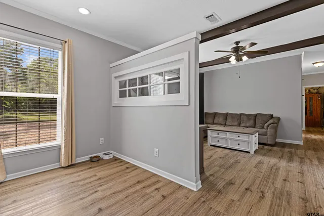 a view of a livingroom with furniture and wooden floor