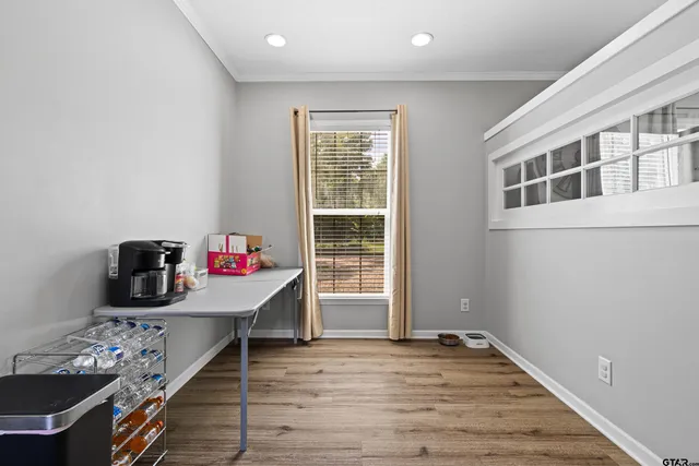 a room with furniture and wooden floor