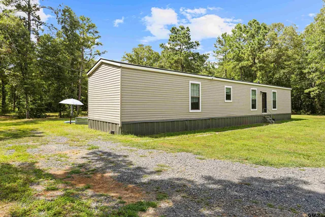 a view of a backyard with a garden