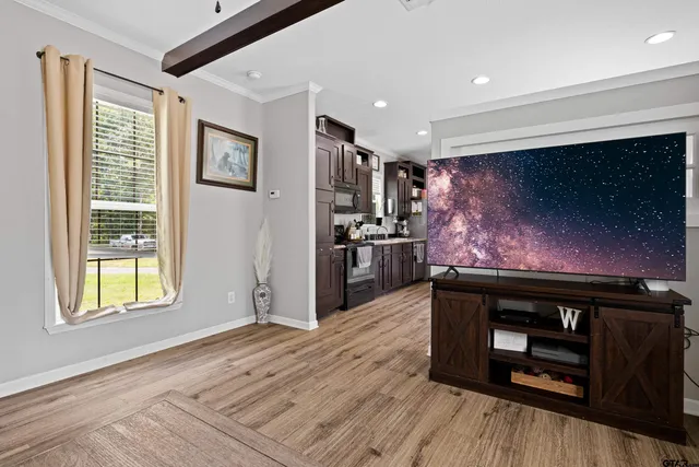 a room with furniture and flat screen tv