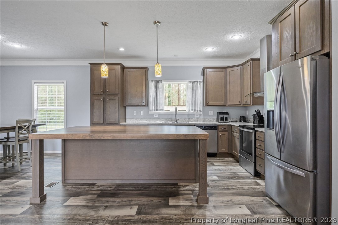 2252 Old Stage Road South Erwin, NC 28339 - Photo 4 of 47 a kitchen with stainless steel appliances granite countertop a refrigerator a sink dishwasher a stove and a refrigerator