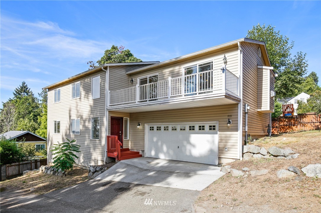 801 Southwest 3rd Place Renton, WA 98057 - Photo 1 of 28 a view of a house with a patio