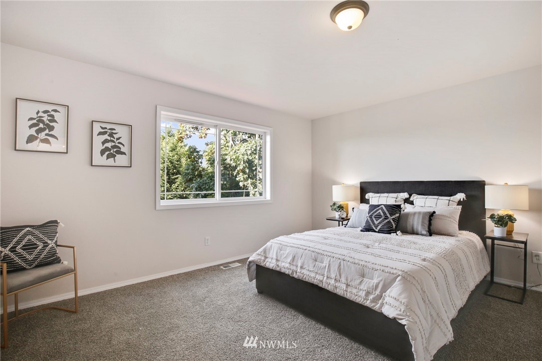 801 Southwest 3rd Place Renton, WA 98057 - Photo 16 of 28 a bedroom with a bed and a window