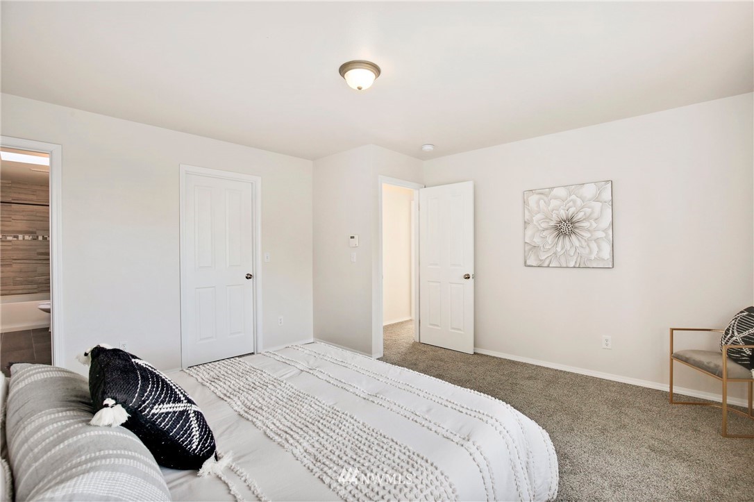 801 Southwest 3rd Place Renton, WA 98057 - Photo 17 of 28 a bedroom with a bed and a couch