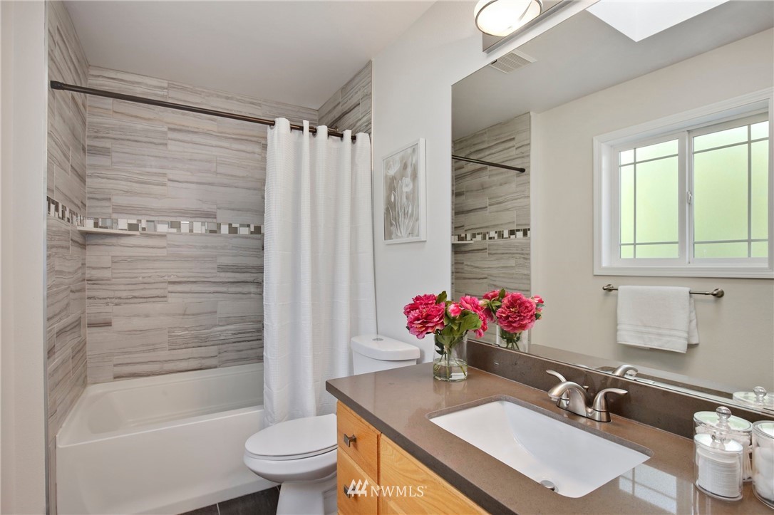 801 Southwest 3rd Place Renton, WA 98057 - Photo 18 of 28 a bathroom with a sink toilet and shower