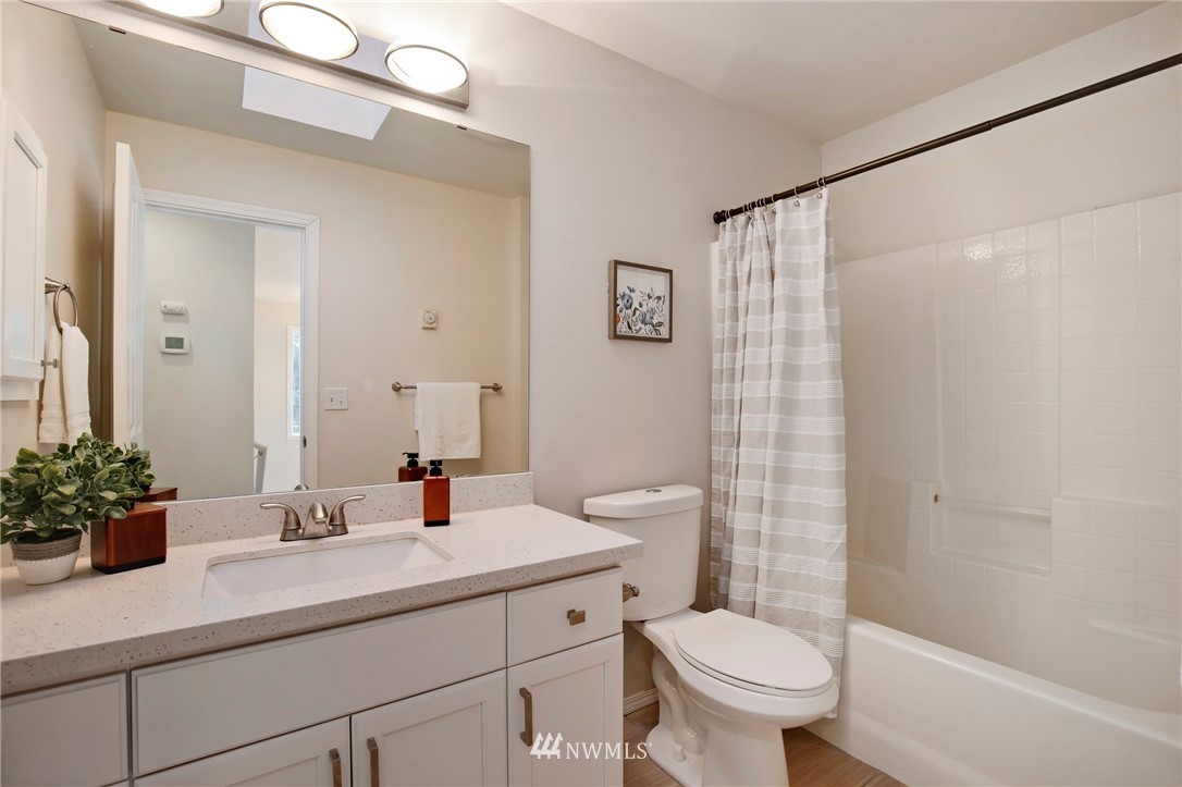 801 Southwest 3rd Place Renton, WA 98057 - Photo 20 of 28 a bathroom with a sink toilet and shower
