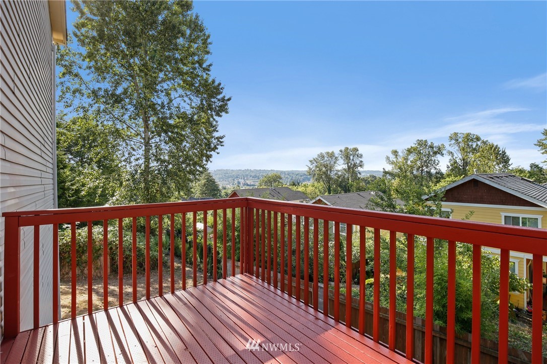 801 Southwest 3rd Place Renton, WA 98057 - Photo 22 of 28 a balcony with wooden floor and outdoor space