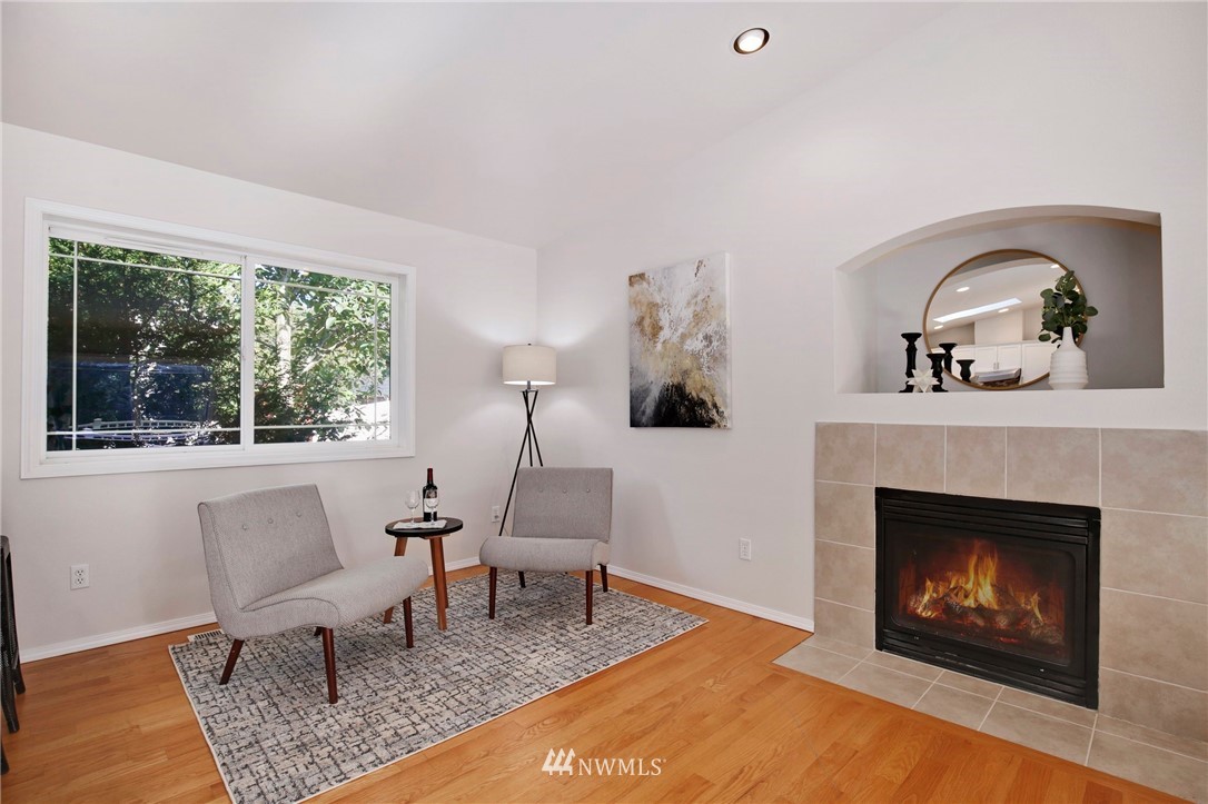 801 Southwest 3rd Place Renton, WA 98057 - Photo 4 of 28 a living room with furniture and a fireplace