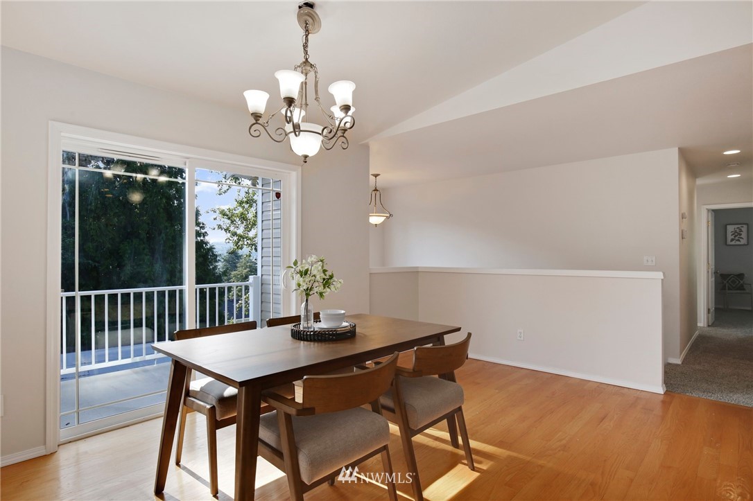 801 Southwest 3rd Place Renton, WA 98057 - Photo 8 of 28 a view of a dining room with furniture window and wooden floor