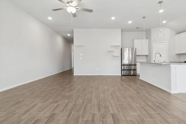 a view of kitchen with stainless steel appliances refrigerator and microwave