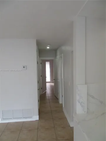 a bathroom with a granite countertop shower a toilet and a sink