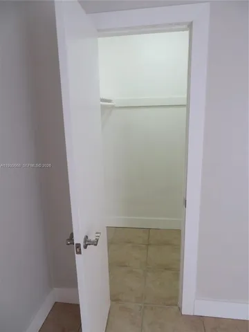 an empty room with a empty space and a window