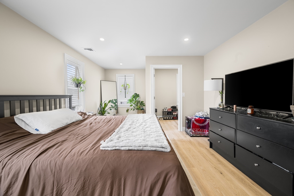 40 Bates Road Framingham, MA 01702 - Photo 15 of 25 a bedroom with a bed and a flat screen tv