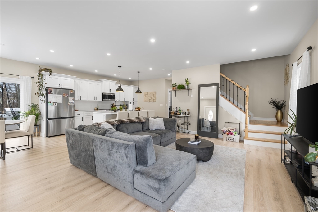 40 Bates Road Framingham, MA 01702 - Photo 2 of 25 a living room with furniture kitchen view and a large window