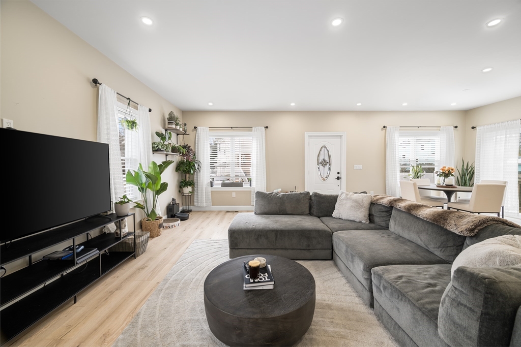40 Bates Road Framingham, MA 01702 - Photo 9 of 25 a living room with furniture and a flat screen tv
