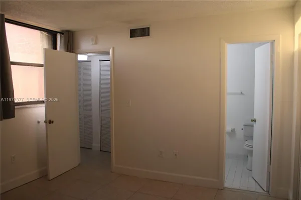 a view of a room that has a window in it