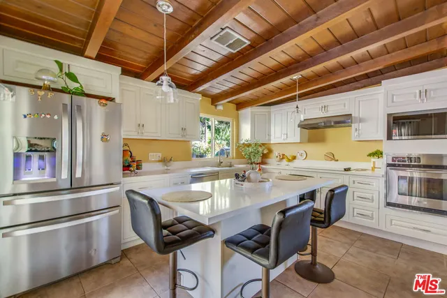 $1,450,000 | 4425 Don Miguel Drive, Los Angeles, CA 90008