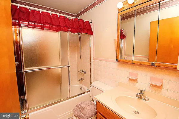 a bathroom with a sink and a shower