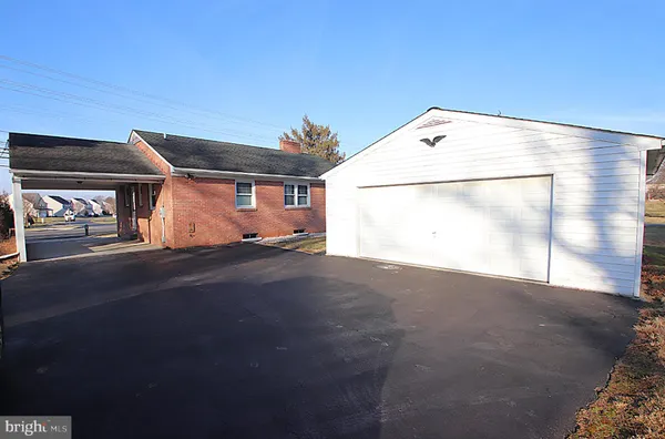 a backyard of a house with garage