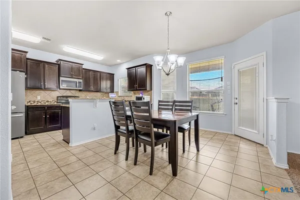 a view of a dining room kitchen and a window