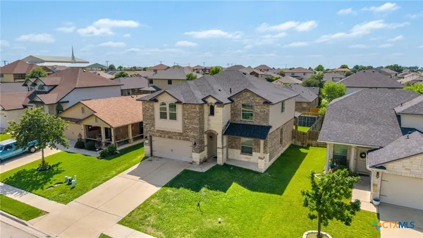 an aerial view of a house with a garden