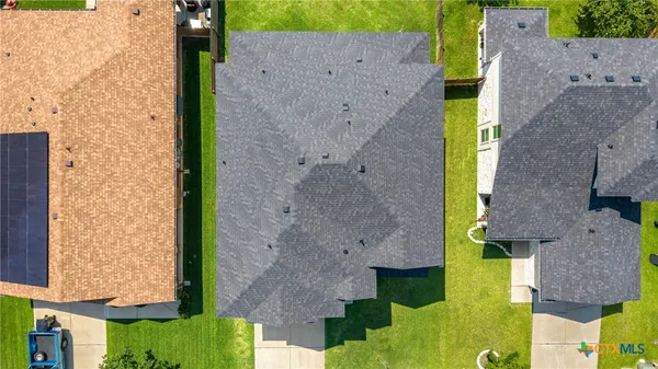 an aerial view of houses with outdoor space