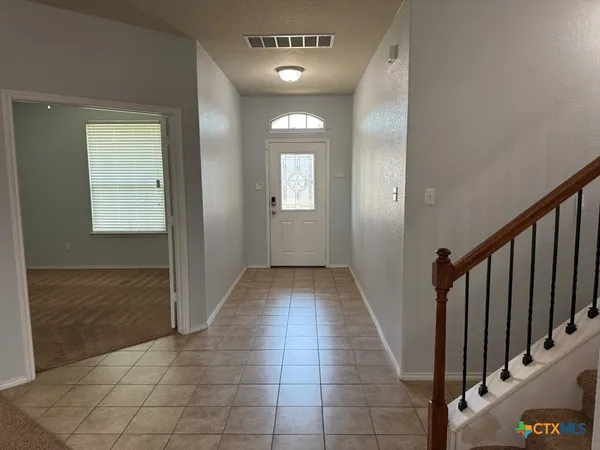 a view of a hallway with entryway