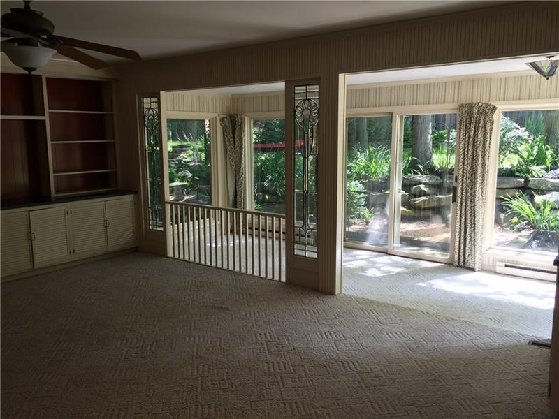 735 Koonce Road Hermitage, PA 16148 - Photo 11 of 25 FAMILY ROOM HAS BUILT-INS AND LEADED GLASS PANELS