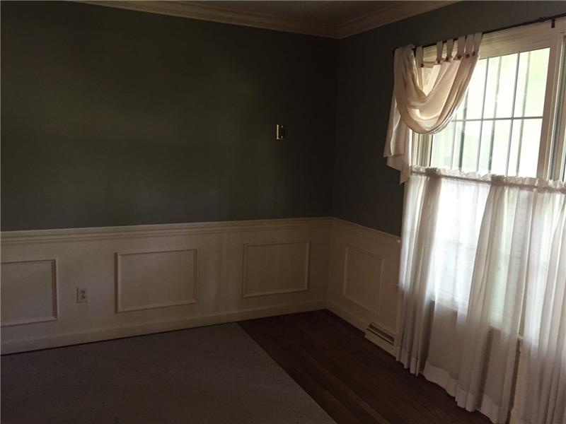 FORMAL DINING ROOM HAS HARDWOOD FLOOR 