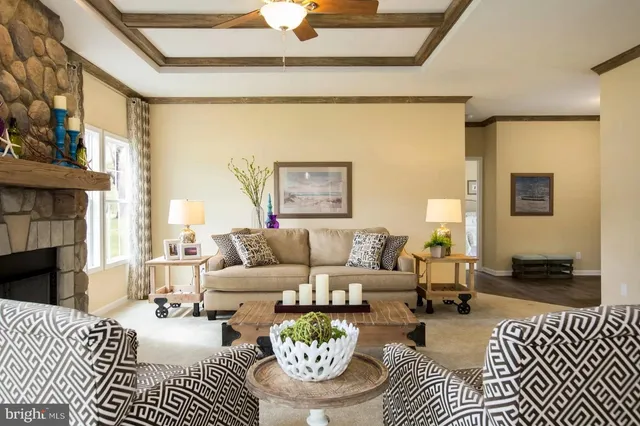 a living room with furniture a fireplace and a table