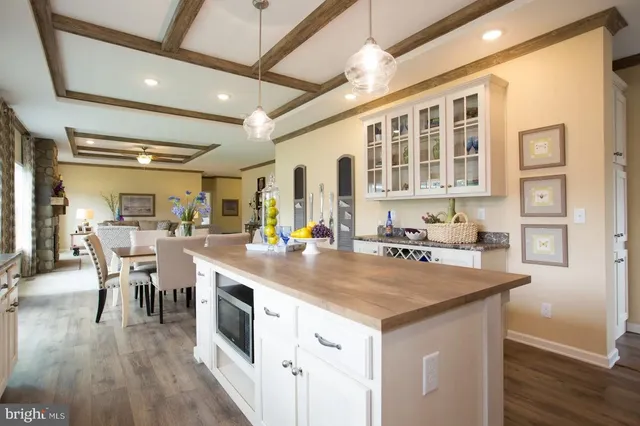 a view of a kitchen counter space and wooden floor