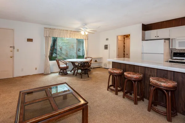 a kitchen with a table chairs and a stove