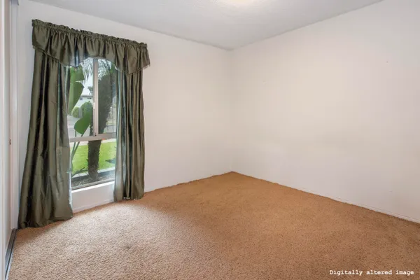 a view of a room with a large window