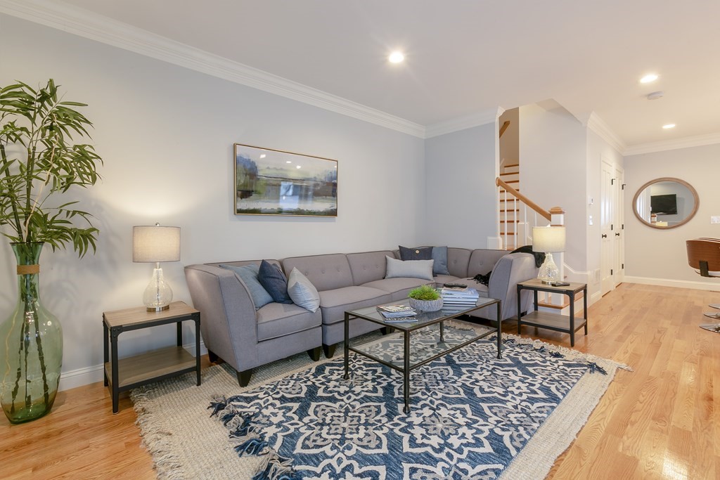 211 West Street, Unit 211 Needham, MA 02494 - Photo 11 of 29 a living room with furniture and wooden floor