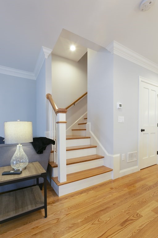 211 West Street, Unit 211 Needham, MA 02494 - Photo 12 of 29 a view of entryway and hall with wooden floor