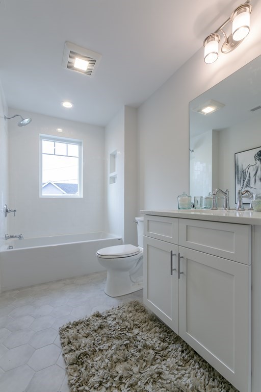 211 West Street, Unit 211 Needham, MA 02494 - Photo 14 of 29 a bathroom with a sink toilet and mirror