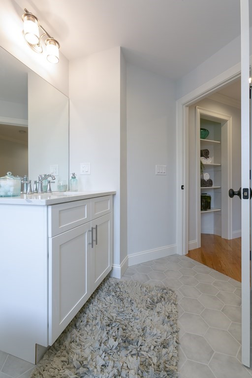 211 West Street, Unit 211 Needham, MA 02494 - Photo 15 of 29 a bathroom with a sink a toilet and shower