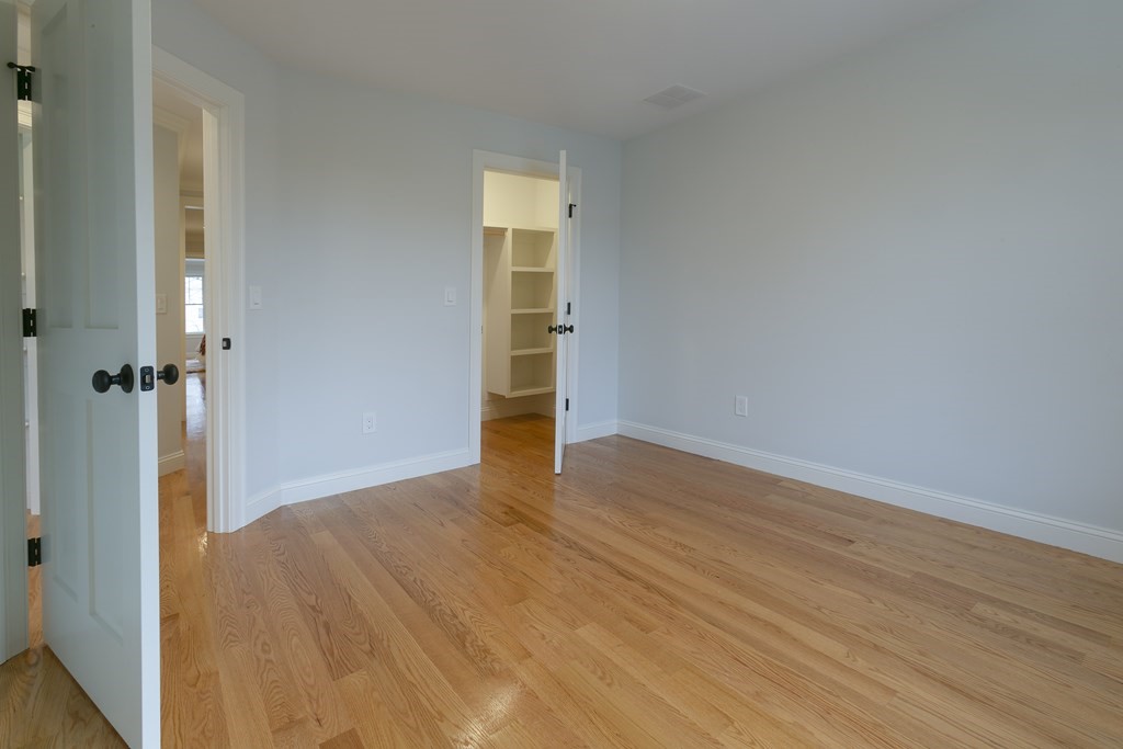 211 West Street, Unit 211 Needham, MA 02494 - Photo 16 of 29 wooden floor in an empty room