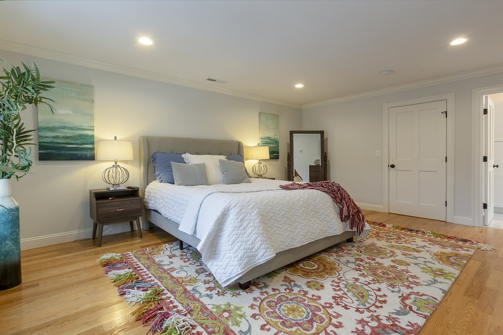 211 West Street, Unit 211 Needham, MA 02494 - Photo 19 of 29 a bedroom with a bed and a dresser