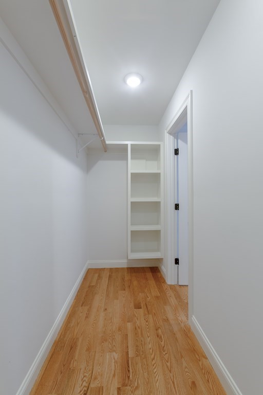 211 West Street, Unit 211 Needham, MA 02494 - Photo 20 of 29 a view of empty room with wooden floor
