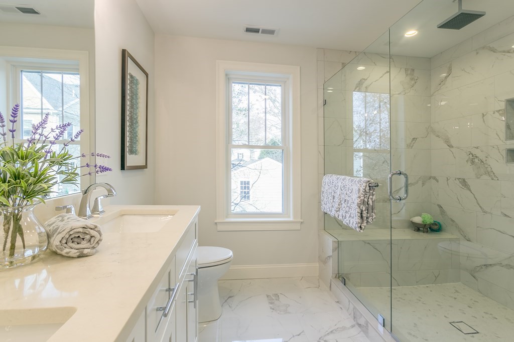211 West Street, Unit 211 Needham, MA 02494 - Photo 22 of 29 a bathroom with a sink a toilet and shower