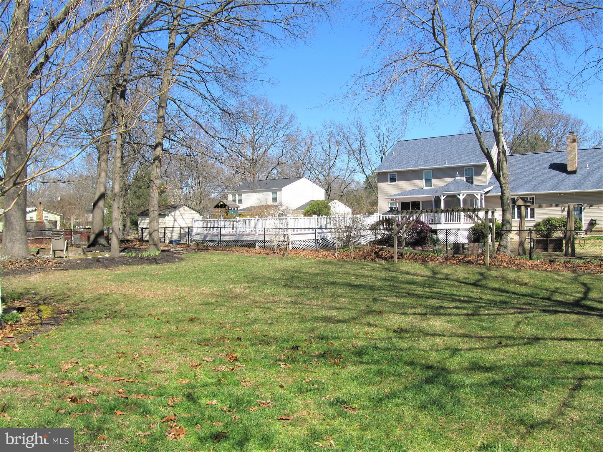 7883 Poplar Grove Road Severn, MD 21144 - Photo 62 of 77 a backyard of a house with lots of green space