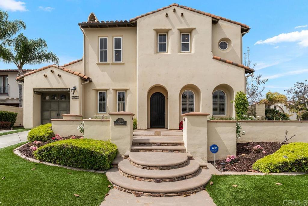 7403 La Mantanza San Diego, CA 92127 - Photo 1 of 74 a front view of a house with a garden and plants